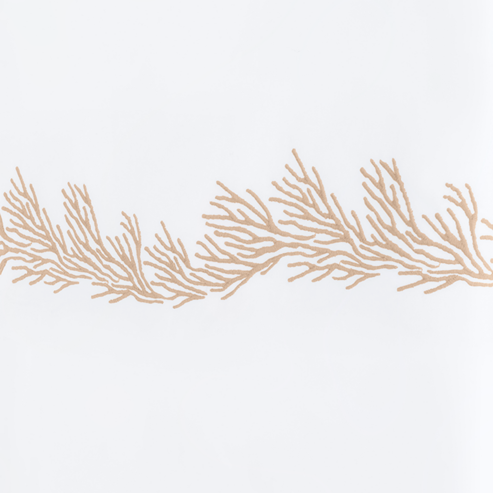 Full Lifestyle Image of Matouk Atoll Bedding Collection with Swatch of Reef