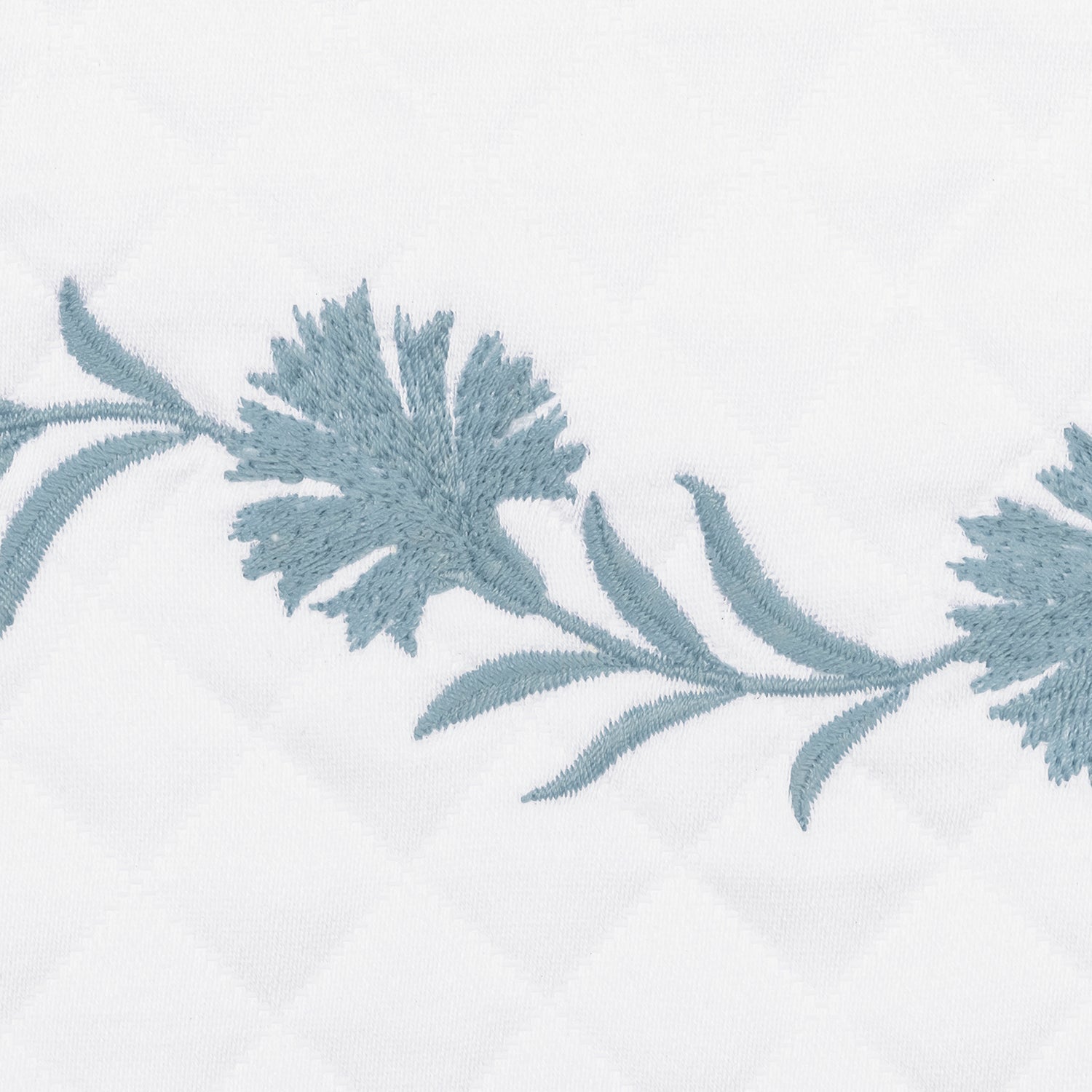 A side view of Matouk Daphne Matelasse Bedding