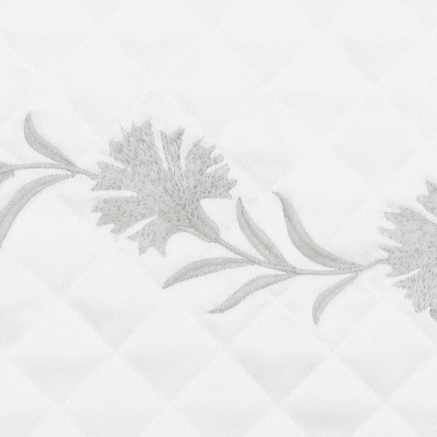 A side view of Matouk Daphne Matelasse Bedding