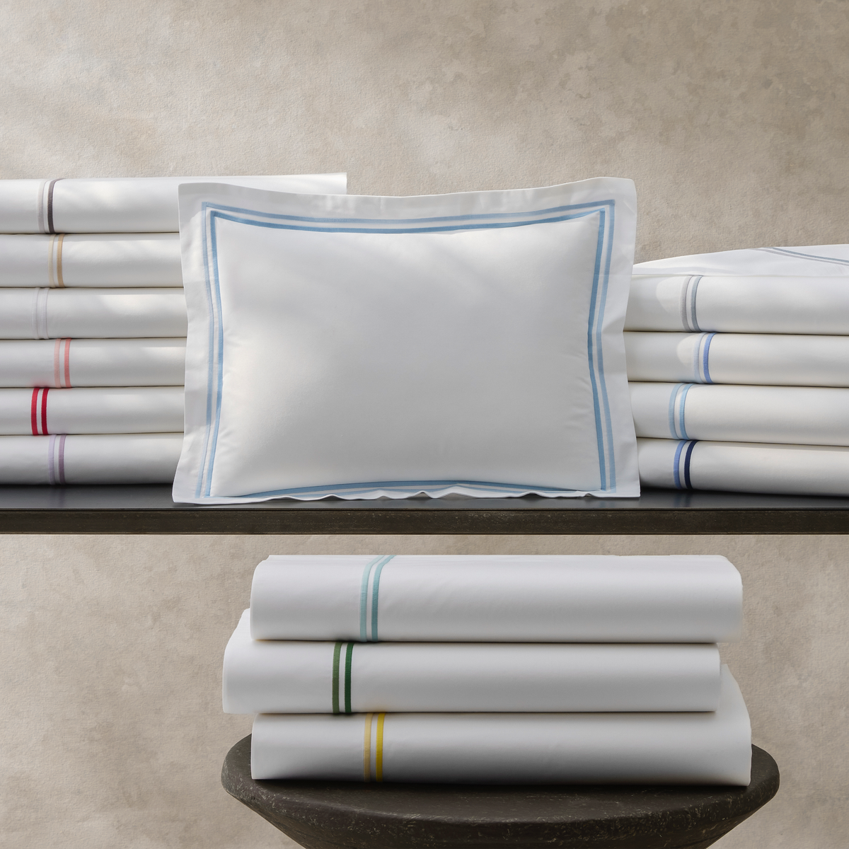 Stack of Matouk Essex Bedding Sheet Sets All Colors