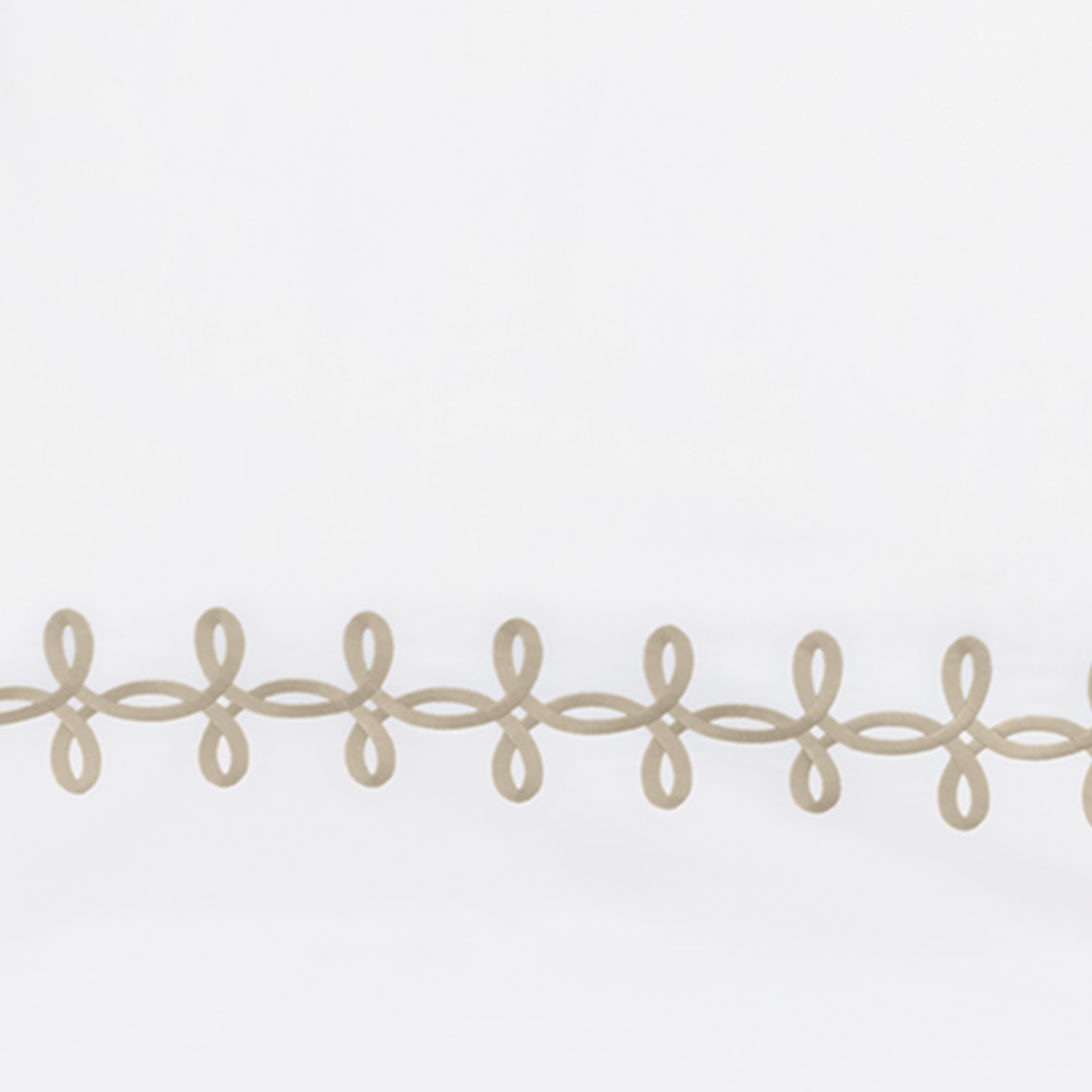 Full Lifestyle Image of Matouk Gordian Knot Bedding with Swatch of Truffle