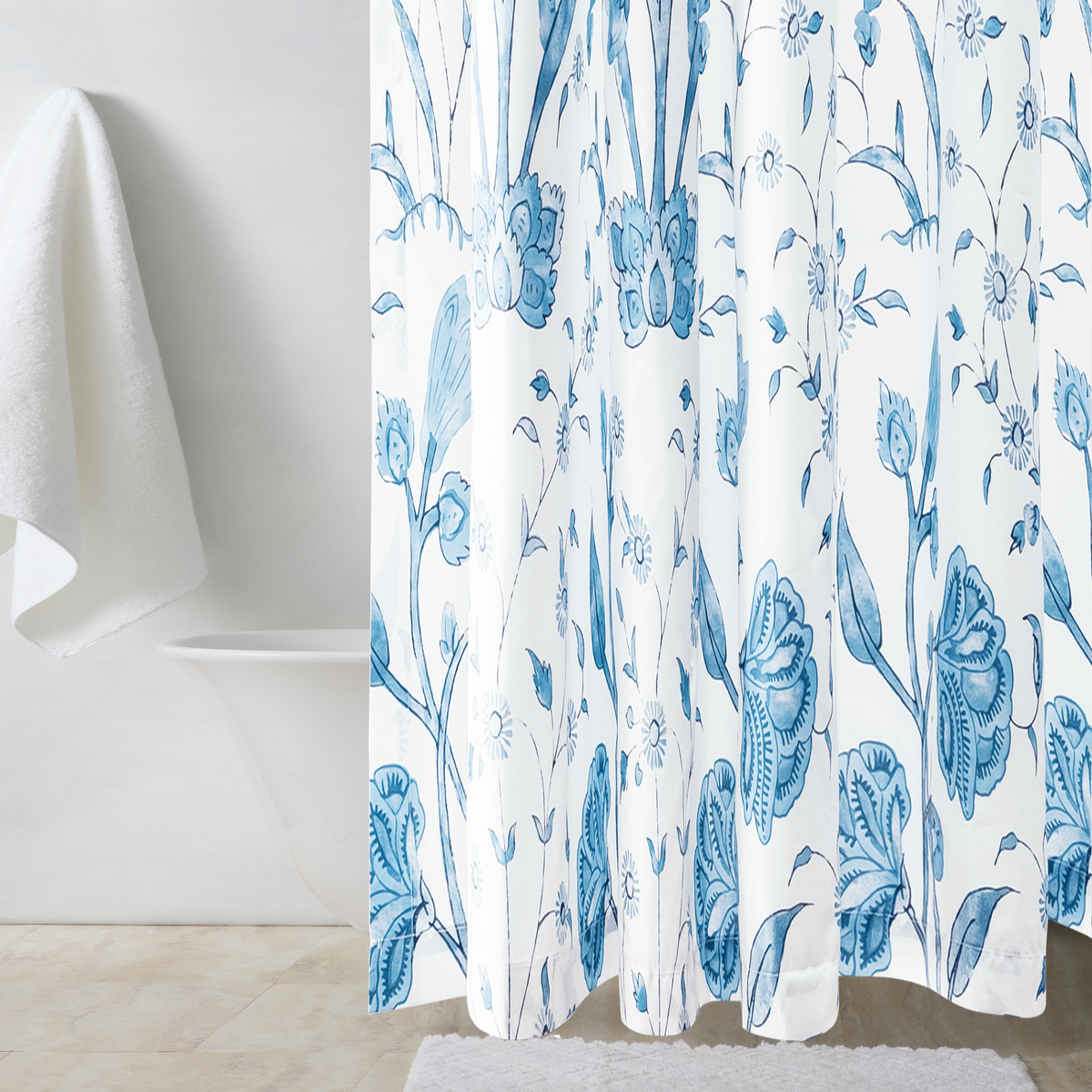 Bath Tub Behind a Matouk Schumacher Khilana Shower Curtain in Azure Color