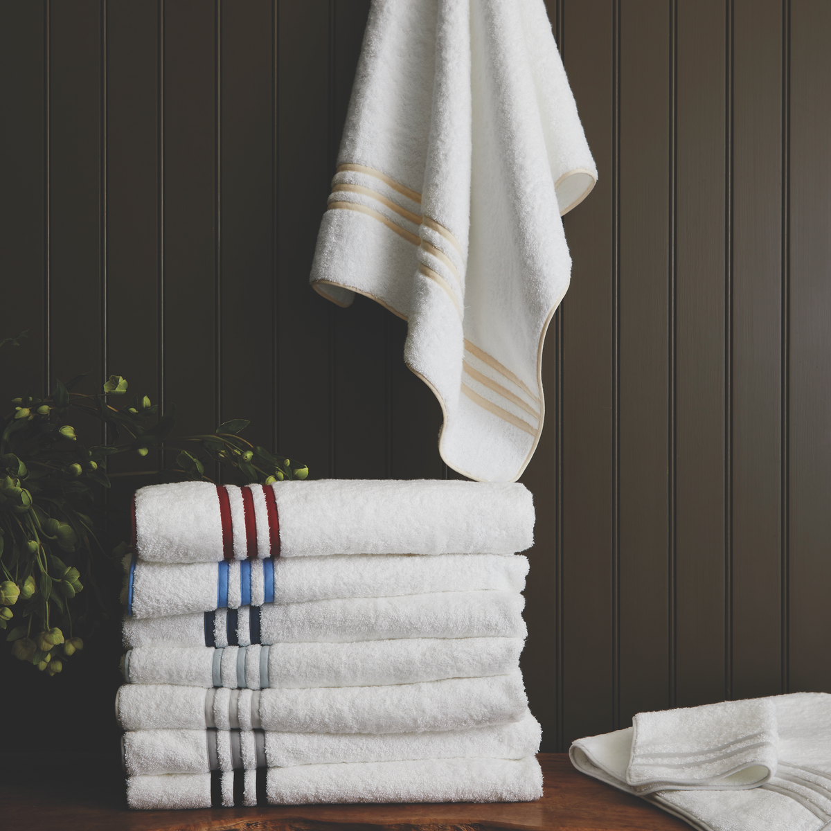 Lifestyle Image Showing All Colors of Matouk Newport Bath Towels and Mat