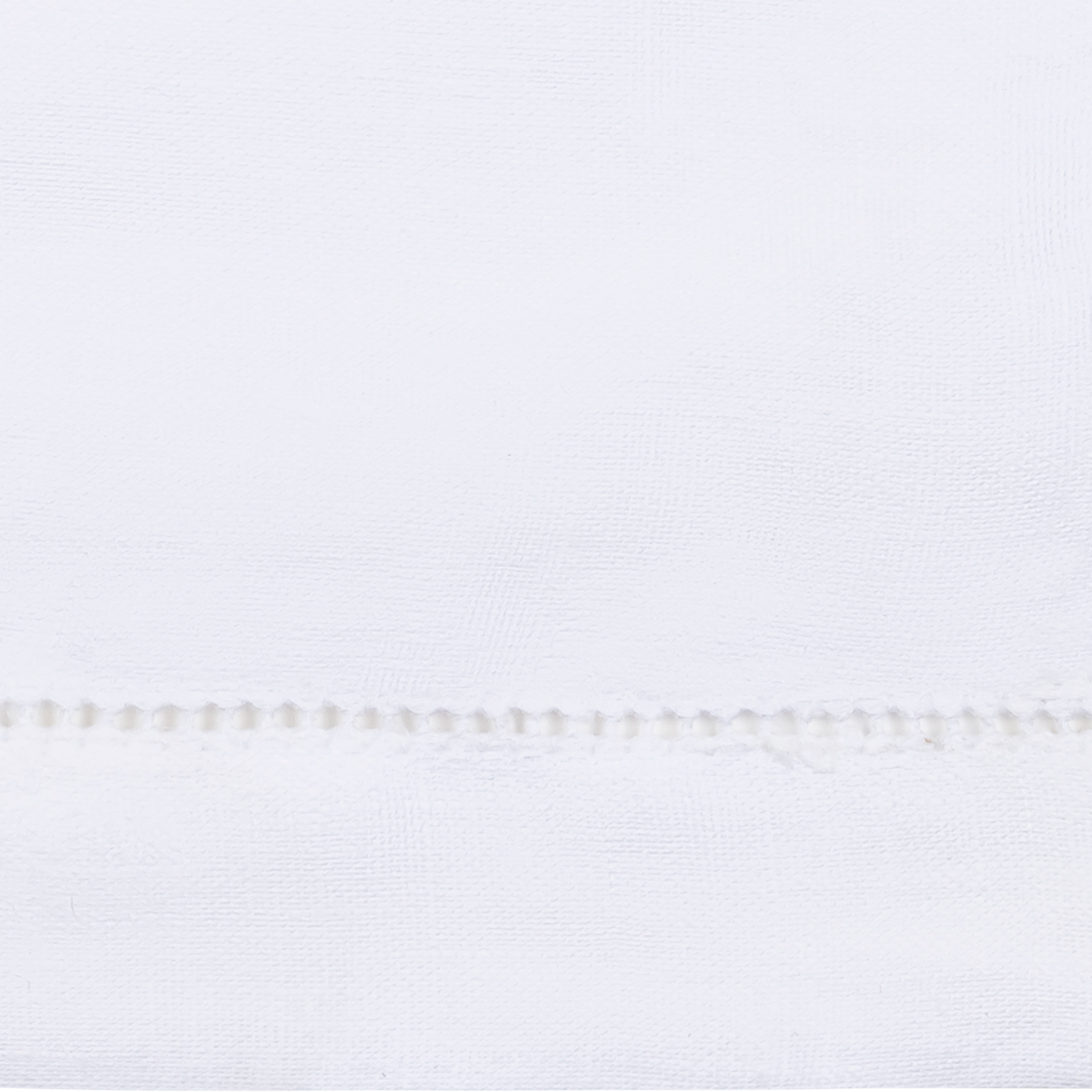 A Stack of Matouk Roman Hemstitch Bedding Shams and Fine Linens