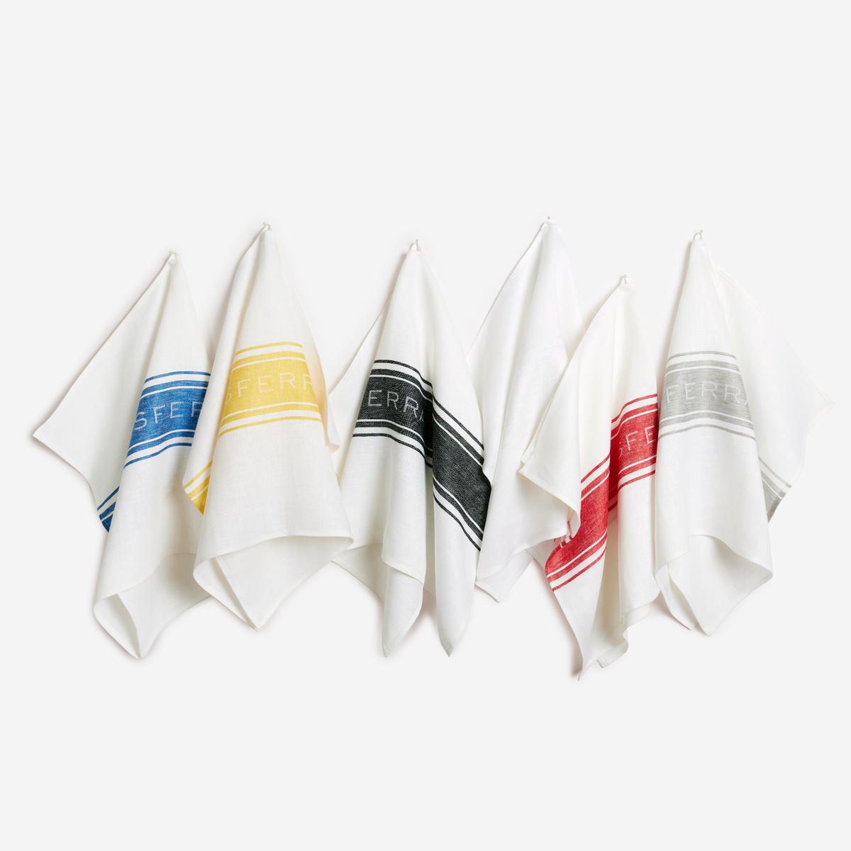 All Colors of Sferra Parma Kitchen Towels Hanging Multi Color Against White Background