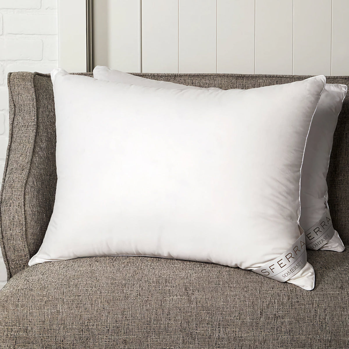 Two Sferra Somerset Down Pillows on a couch