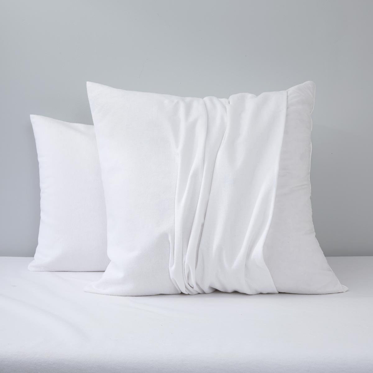 Two White Yves Delorme Pillow Protector on Bedding