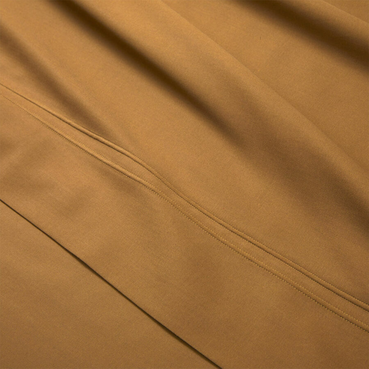 Closeup of Fabric of Yves Delorme Triomphe Sheet Sets in Bronze Color