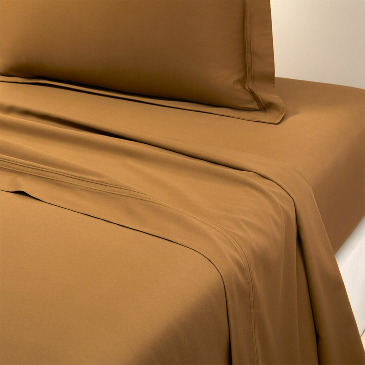 Closeup of Flat Sheet Yves Delorme Triomphe Bedding in Bronze Color