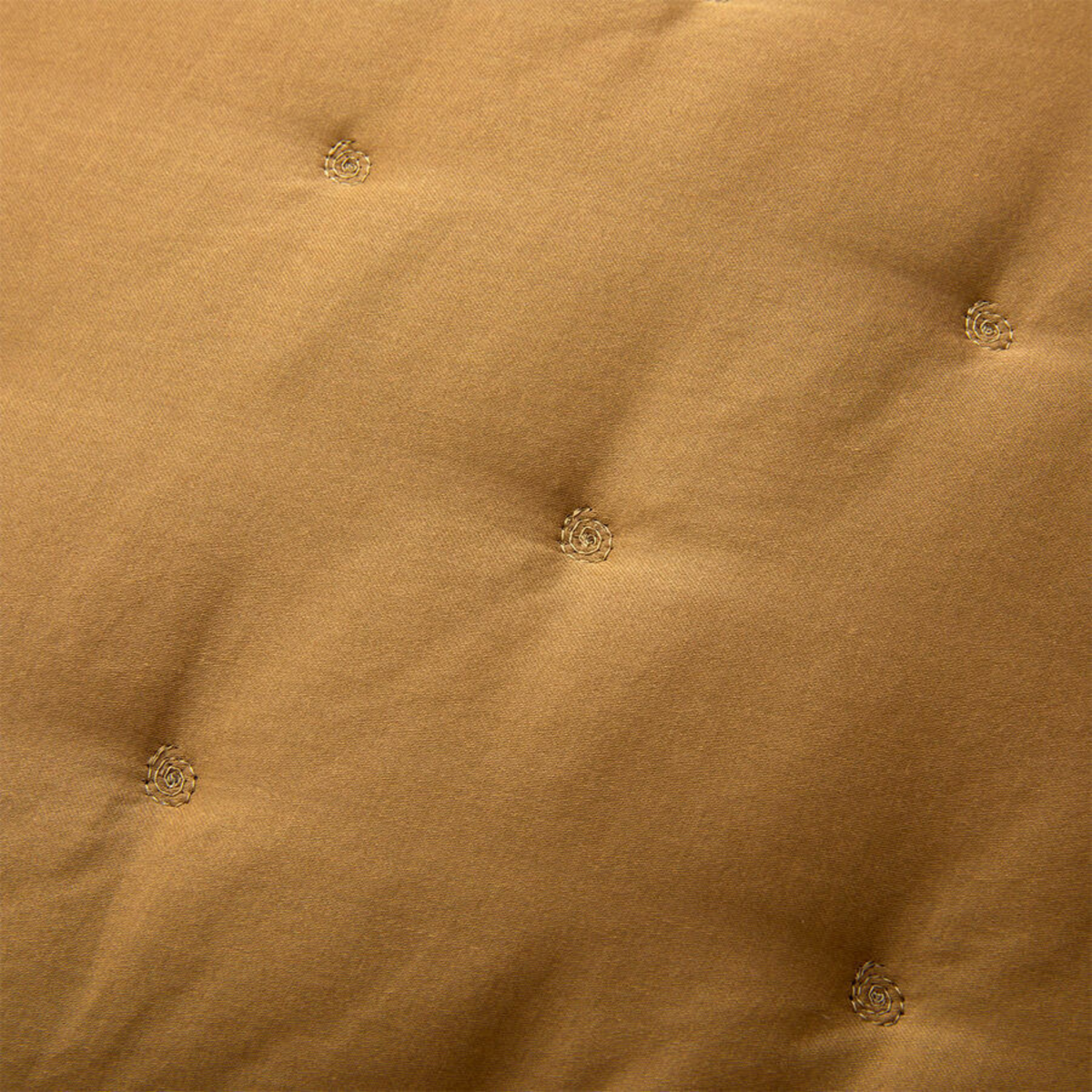 Closeup of Quilting of Yves Delorme Triomphe Bedding Bronze Color