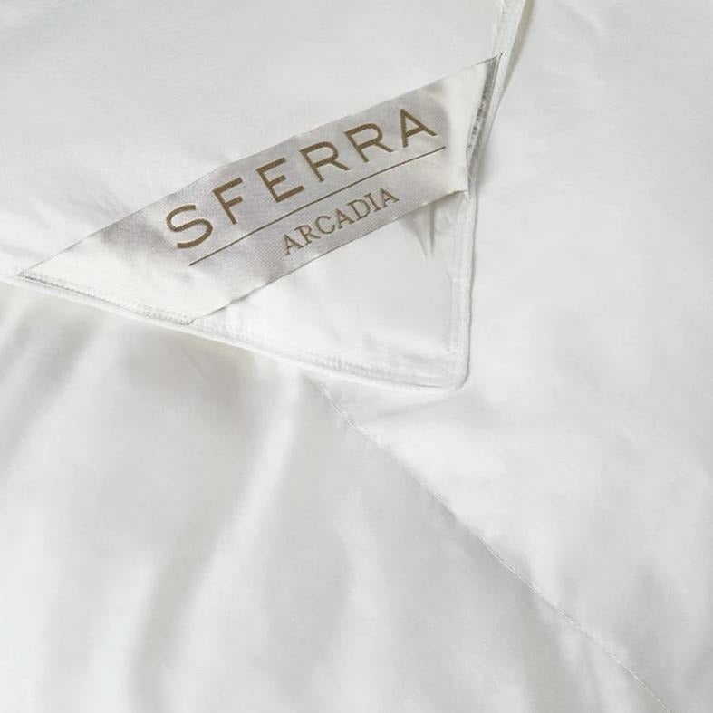 A close up of Sferra Arcadia Logo on a Duvet Cover Fine Linens