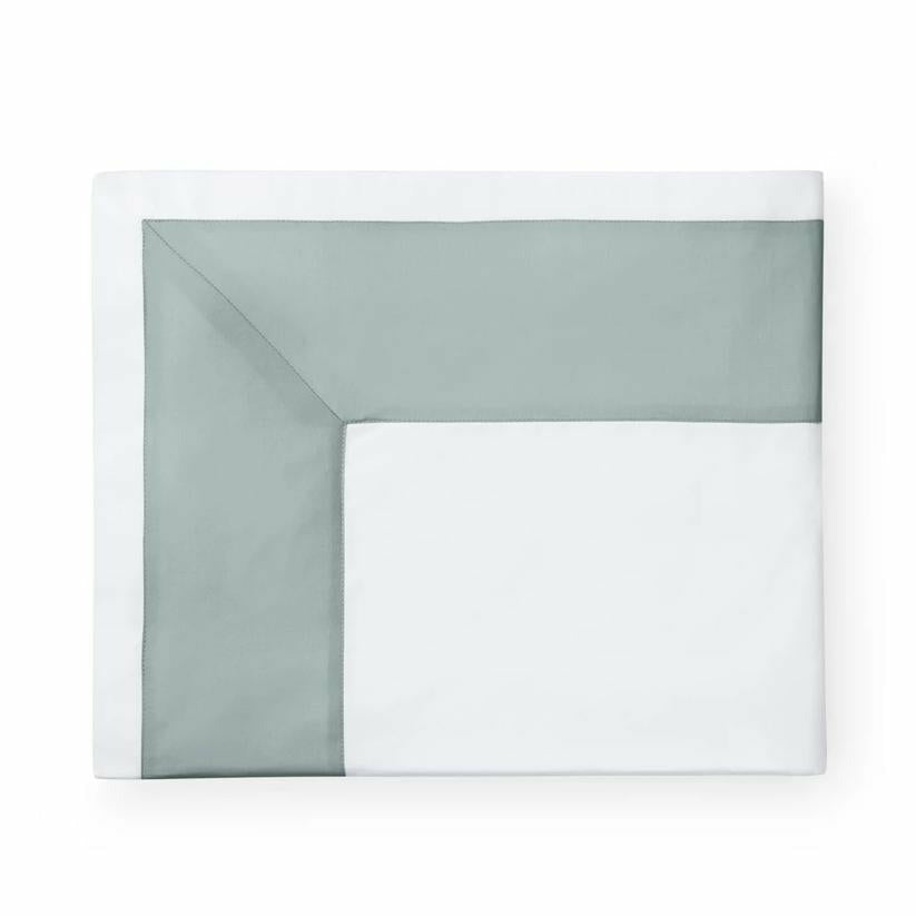 Folded Flat Sheet of Sferra Casida Bedding in Color White/Seagreen